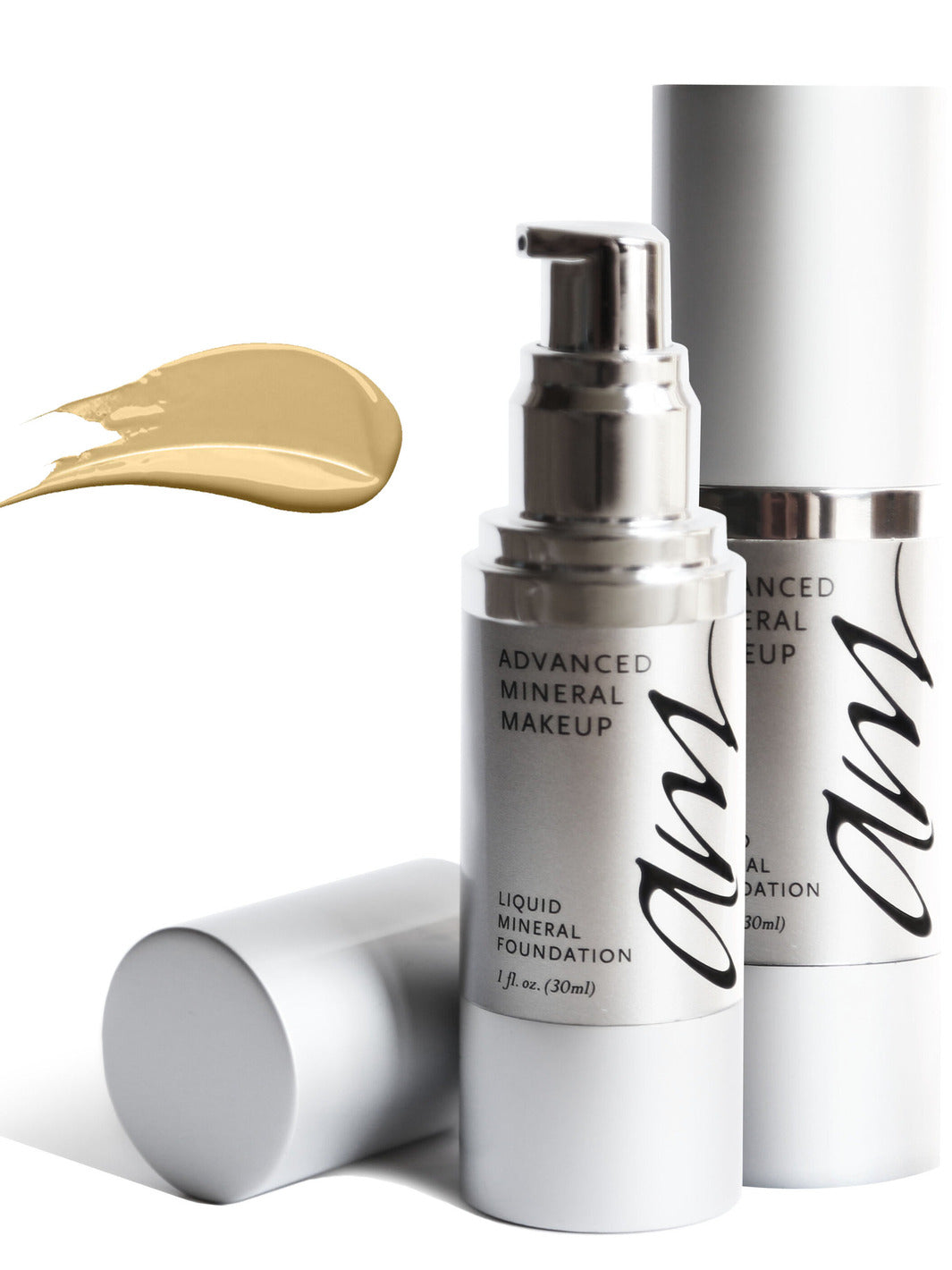 A couple small pump makeup bottles with a smear swatch in the background. #colour_cream-puff