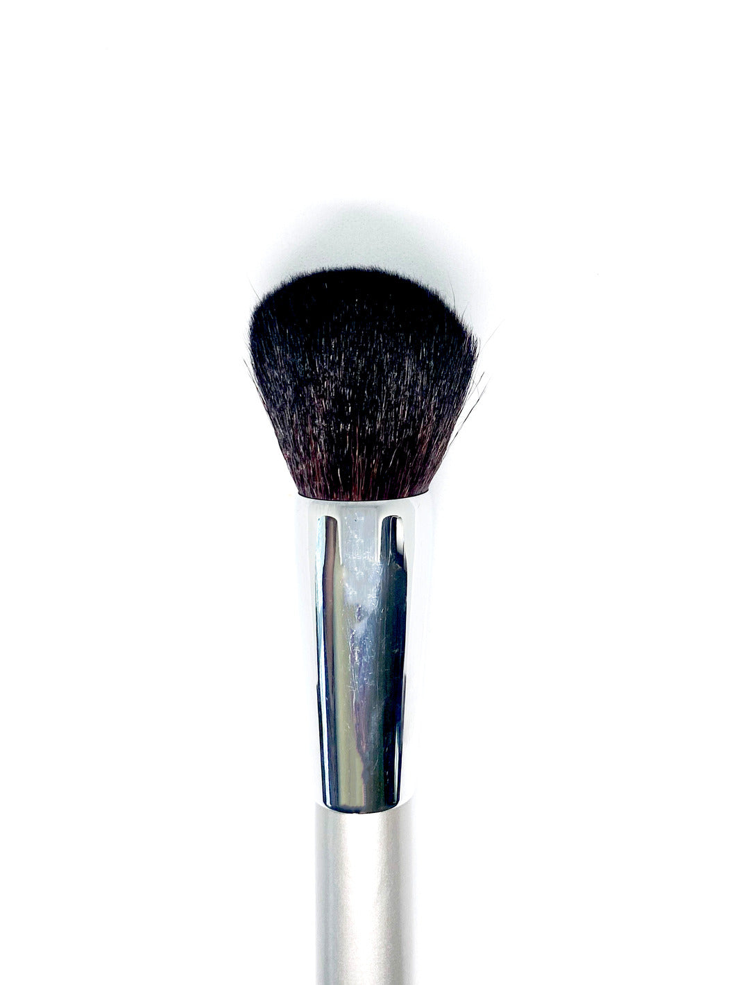 A small brown makeup brush.