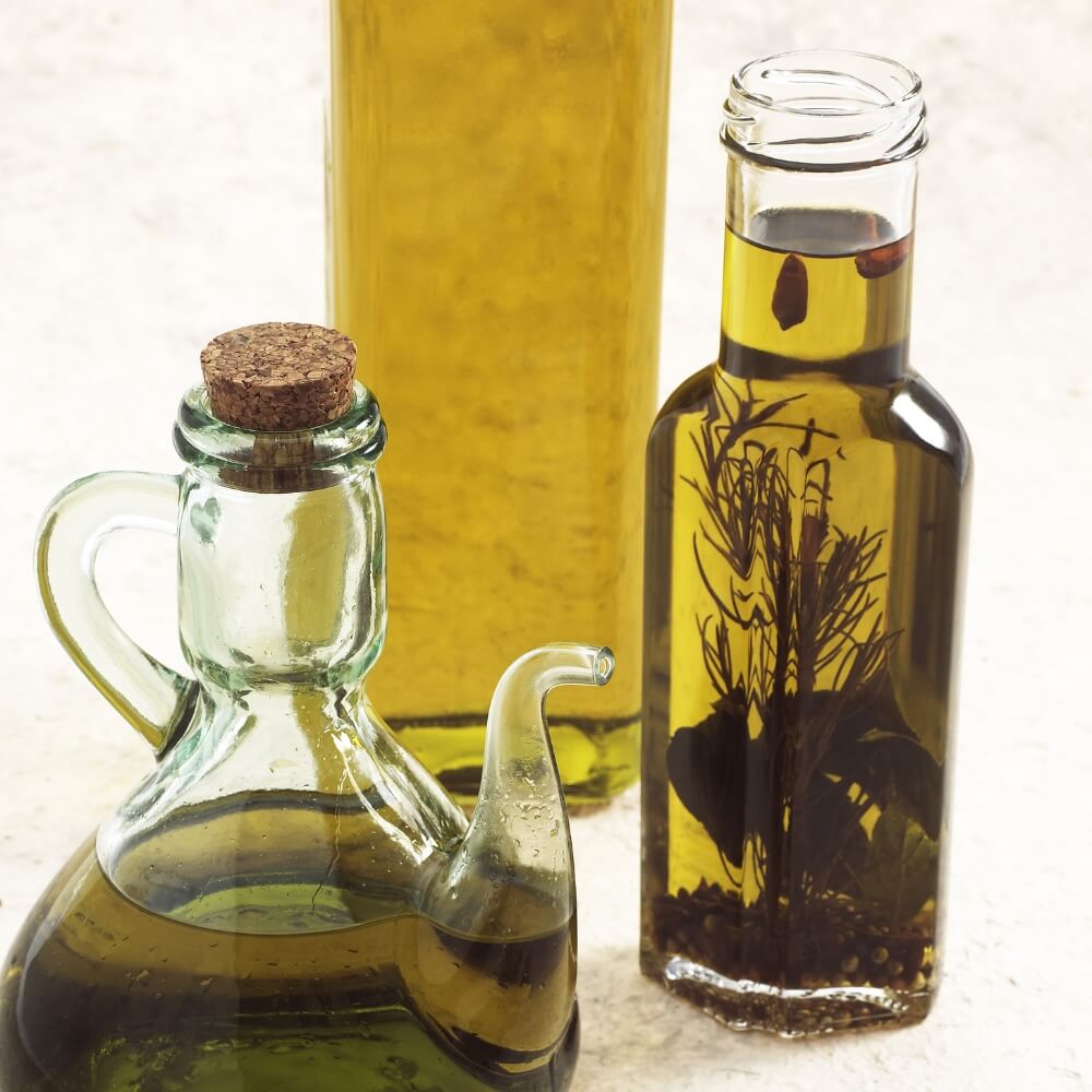 3 unique jars of olive oil.