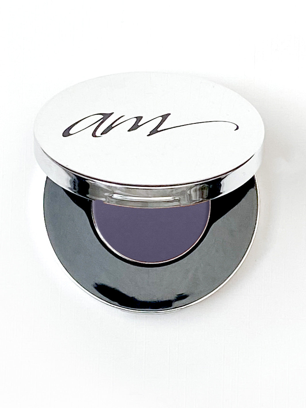The top view of an advanced mineral makeup compact with powder contents in the color of 'black-plum' and the lid half way off. #colour_black-plum