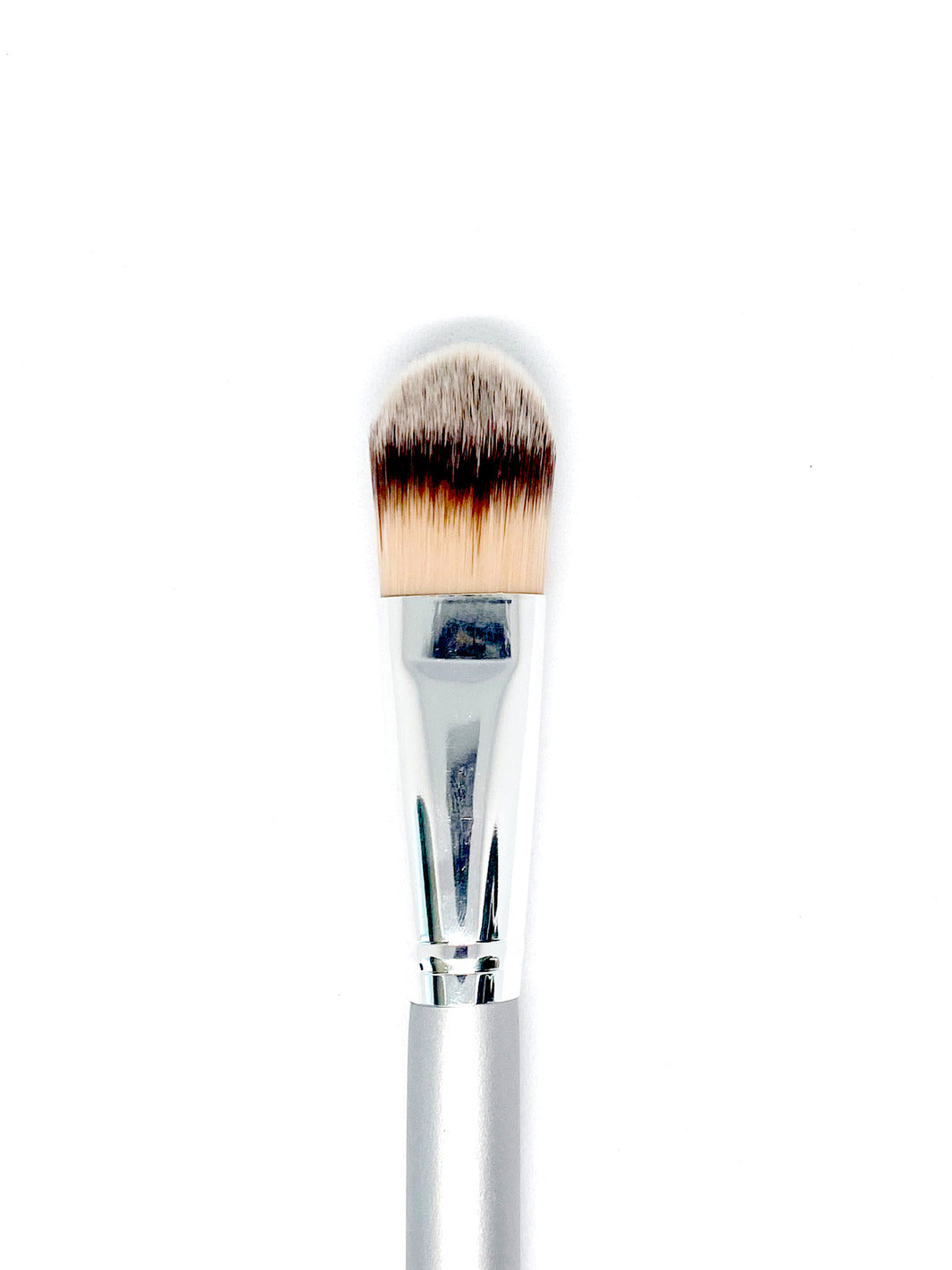 A three tone white, cream and gray makeup brush.