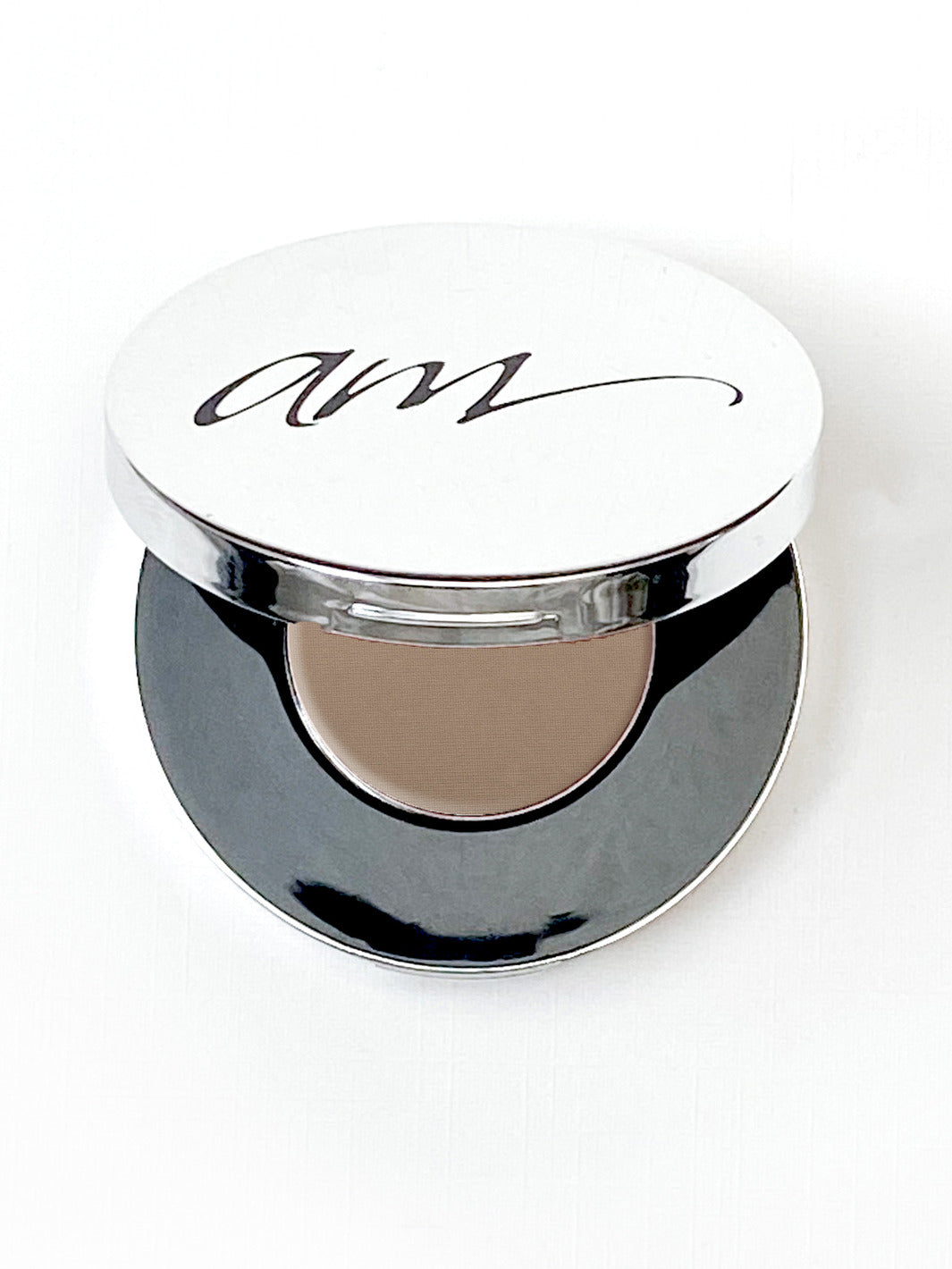 The top view of an advanced mineral makeup compact with powder contents in the color of 'heather' and the lid half way off. #colour_heather