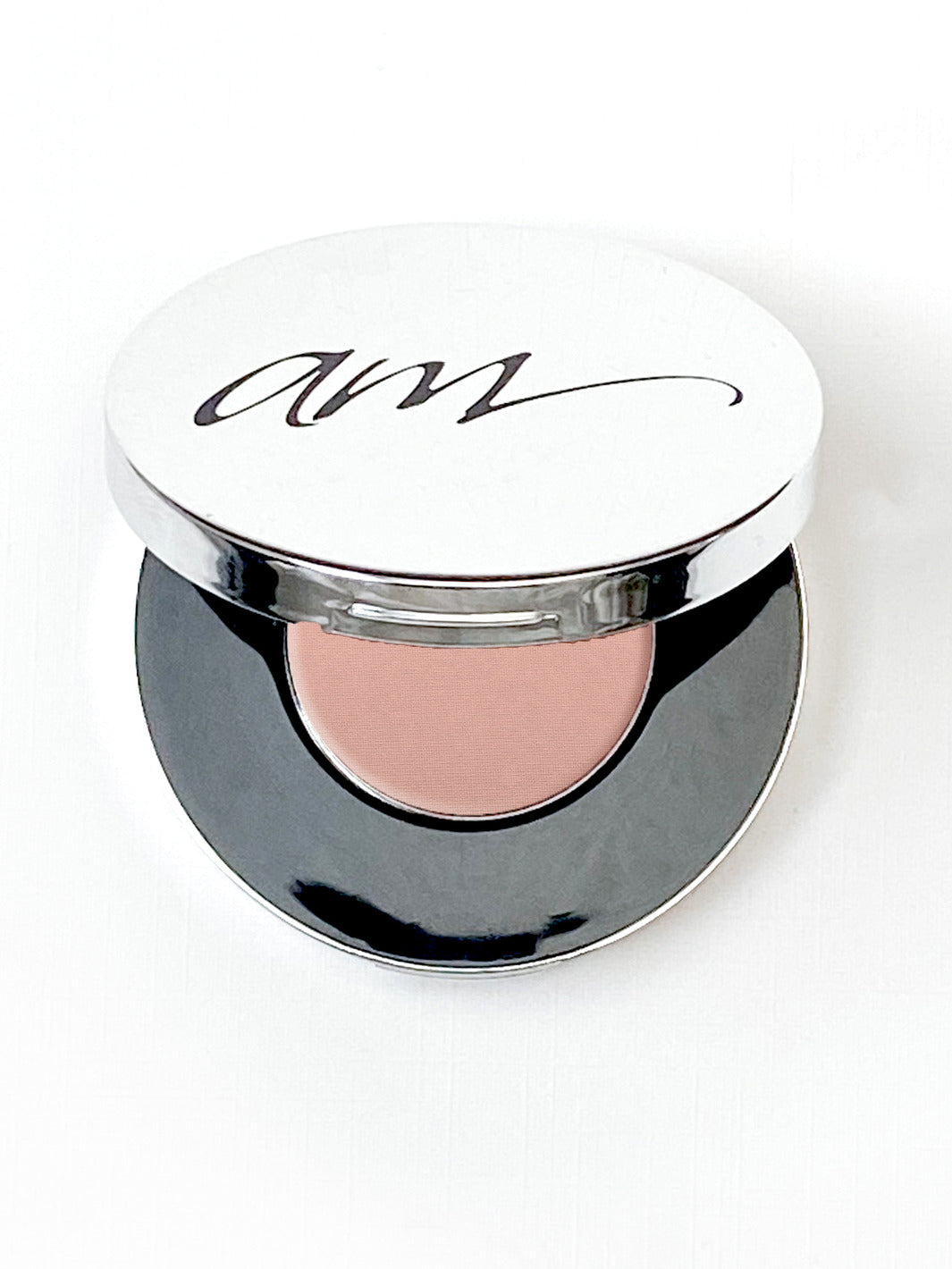The top view of an advanced mineral makeup compact with powder contents in the color of 'pink-champagne' and the lid half way off. #colour_pink-champagne