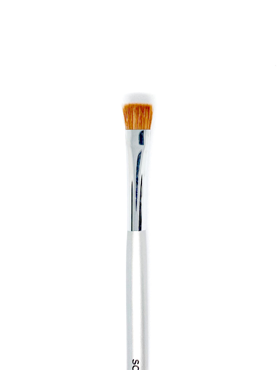 A long makeup brush with orange bristles that is called a square detail brush.