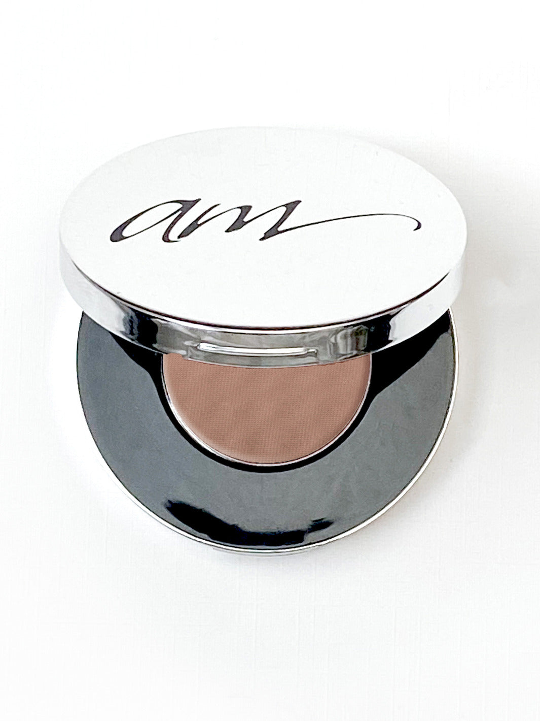 The top view of an advanced mineral makeup compact with powder contents in the color of 'Golden Sand' and the lid half way off. #colour_golden-sand